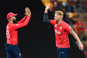 BRISBANE, AUSTRALIA - NOVEMBER 01: Moeen Ali and Ben Stokes of England celebrate a wicket during the ICC Men's T20 World Cup match between England and New Zealand at The Gabba on November 01, 2022 in Brisbane, Australia. (Photo by Albert Perez/Getty Images)