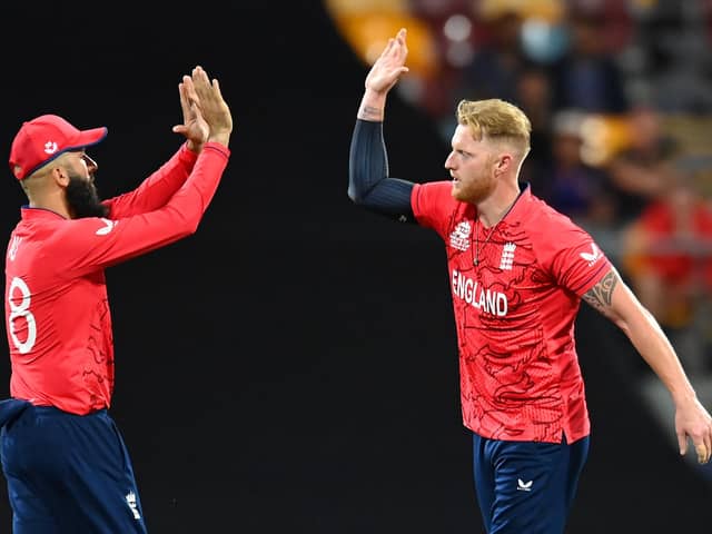BRISBANE, AUSTRALIA - NOVEMBER 01: Moeen Ali and Ben Stokes of England celebrate a wicket during the ICC Men's T20 World Cup match between England and New Zealand at The Gabba on November 01, 2022 in Brisbane, Australia. (Photo by Albert Perez/Getty Images)