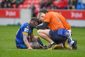 Wakefield Trinity hooker Liam Hood receives treatment for a head injury. (Photo: Olly Hassell/SWpix.com)