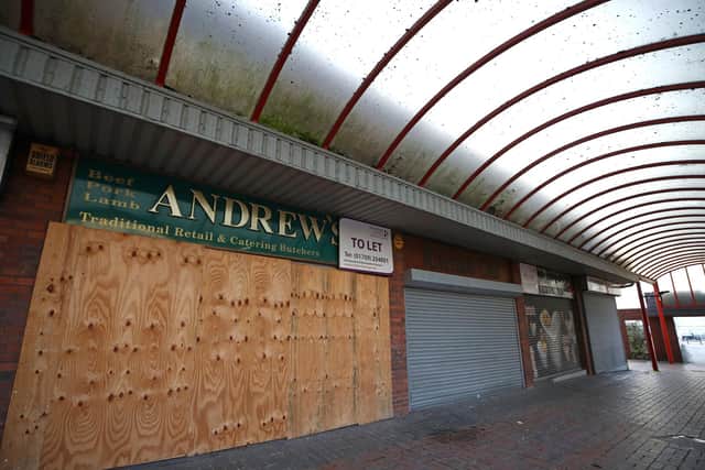 File photo dated 19/12/20 of boarded up shops inside an empty shopping precinct in Rotherham town centre