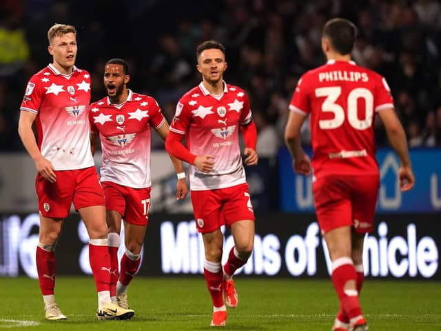 Barnsley's Sam Cosgrove (left) celebrates scoring their side's third goal of the game during the Sky Bet League One play-off, semi-final, second leg match at Bolton. Picture: Martin Rickett/PA Wire.