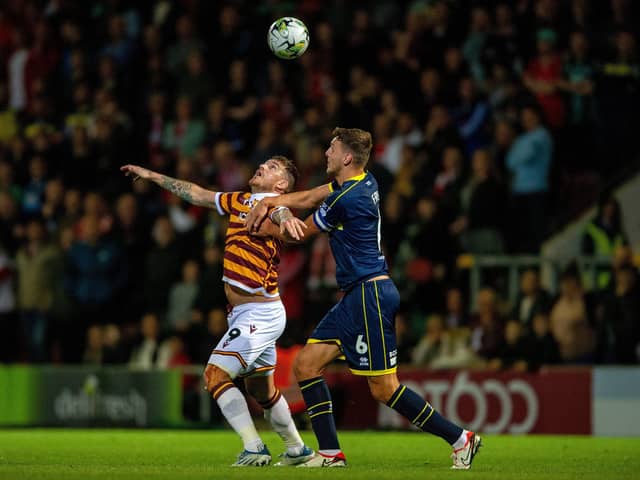 AERIAL BATTLE: Bradford City's Andy Cook and Middlesbrough's Dael Fry challenge for the ball