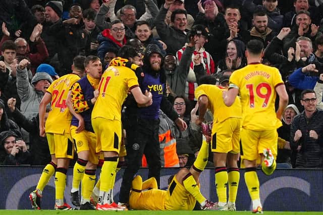 Sheffield United players celebrate their side's equaliser, an own goal scored by Liverpool's Conor Bradley (not pictured) during the Premier League match at Anfield. Photo: Peter Byrne/PA Wire.