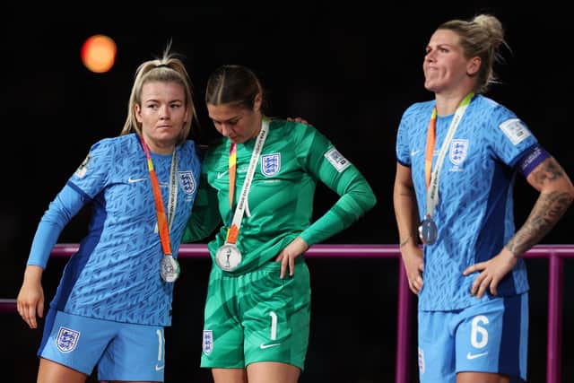 What might have been: Lauren Hemp, Mary Earps and Millie Bright of England look on during the awards ceremony (Picture: Cameron Spencer/Getty Images)