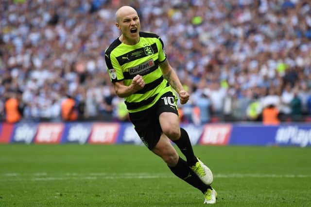BIG MOMENT: Aaron Mooy celebrates scoring his penalty in the shoot-out which took Huddersfield Town into the Premier League