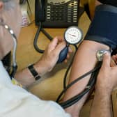 A file photo dated of a GP checking a patient's blood pressure. PIC: Anthony Devlin/PA Wire