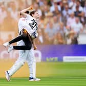 England's Jonny Bairstow removes a Just Stop Oil protester from the pitch during day one of the second Ashes test match at Lord's. Photo credit: Mike Egerton/PA Wire.
