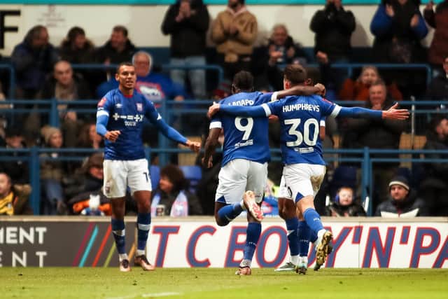 Ipswich Town's Cameron Humphreys celebrates scoring their side's first goal of the game alongside Ipswich Town's Freddie Ladapo and Ipswich Town's Kayden Jackson during the Emirates FA Cup third round match at Portman Road, Ipswich. Picture: Rhianna Chadwick/PA.