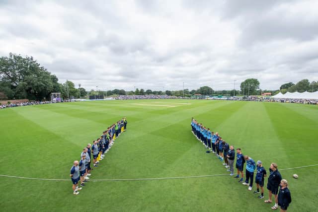 Yorkshire and Hampshire line up for a minute's silence in memory of Sir Michael Parkinson. Picture by Allan McKenzie/SWpix.com