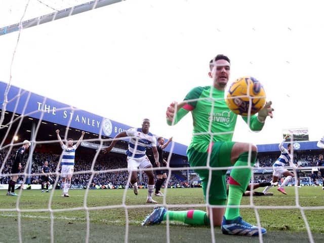 LONDON, ENGLAND - JANUARY 28: (EDITORS NOTE: In this photo taken from a remote camera from behind the goal.) Lee Nicholls of Huddersfield Town reacts after failing to save the shot of Kenneth Paal of Queens Park Rangers which results in their first goal during the Sky Bet Championship match between Queens Park Rangers and Huddersfield Town at Loftus Road on January 28, 2024 in London, England. (Photo by Richard Pelham/Getty Images)