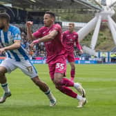 Dig deep: Huddersfield Town's Brodie Spencer gets past Swansea's Ronald Pereira Martins on Saturday before it all went wrong. (Picture: Tony Johnson)