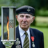 York's last remaining D-Day veteran Ken Cooke, looks at the 'Lighting Their Legacy' torch at Commonwealth War Graves site at Stonefall Cemetery in Harrogate, as the 80th anniversary gets closer,  photographed by Tony Johnson for The Yorkshire Post.