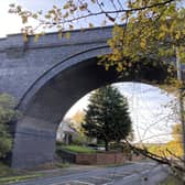 The viaduct passing over the road beneath