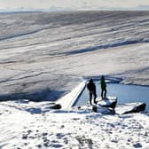 Walkers  are pictured in wintery conditions at March Haigh Reservoir at Marsden Moor, West Yorkshire. Picture by Simon Hulme 16th January 2023










