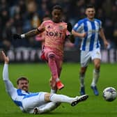 Leeds United's Crysencio Summerville loses out to Huddersfield Town's Danny Ward. Picture: Jonathan Gawthorpe.