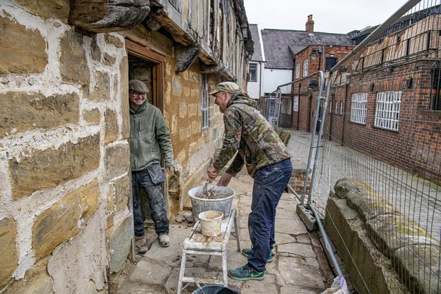 Steve Murray and Darren Marples work with a trditional hot lime mortar