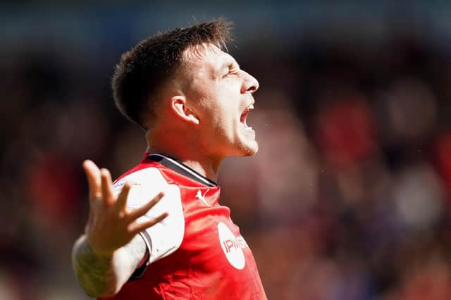 Rotherham United's Jordan Hugill celebrates scoring their side's first goal of the game during the Sky Bet Championship match at the AESSEAL New York Stadium, Rotherham. Picture date: Friday April 7, 2023. PA Photo. See PA story SOCCER Rotherham. Photo credit should read: Mike Egerton/PA Wire.

RESTRICTIONS: EDITORIAL USE ONLY No use with unauthorised audio, video, data, fixture lists, club/league logos or "live" services. Online in-match use limited to 120 images, no video emulation. No use in betting, games or single club/league/player publications.