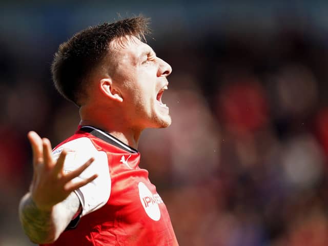 Rotherham United's Jordan Hugill celebrates scoring their side's first goal of the game during the Sky Bet Championship match at the AESSEAL New York Stadium, Rotherham. Picture date: Friday April 7, 2023. PA Photo. See PA story SOCCER Rotherham. Photo credit should read: Mike Egerton/PA Wire.RESTRICTIONS: EDITORIAL USE ONLY No use with unauthorised audio, video, data, fixture lists, club/league logos or "live" services. Online in-match use limited to 120 images, no video emulation. No use in betting, games or single club/league/player publications.