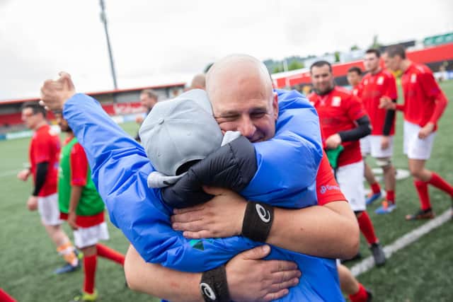 Library image of International Mixed Ability Rugby Tournament World Cup, Musgrave Park, Cork. Riccardo Bego from Chivasso Rugby from Italy receives a hug from Francesco Pittingaro after the game (Photo supplied by INPHO/Tom Maher)