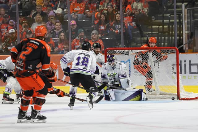 STARTER: Ryan Tait (partially hidden) scores Sheffield Steelers' opening goal against Manchester Storm on Wednesday night. Picture: Hayley Roberts/Steelers Media