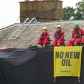 Greenpeace activists on the roof of Prime Minister Rishi Sunak's house in Richmond. PIC: Danny Lawson/PA Wire