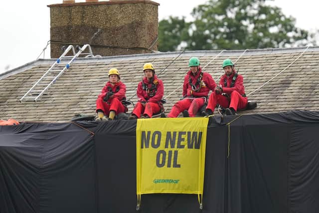 Greenpeace activists on the roof of Prime Minister Rishi Sunak's house in Richmond. PIC: Danny Lawson/PA Wire