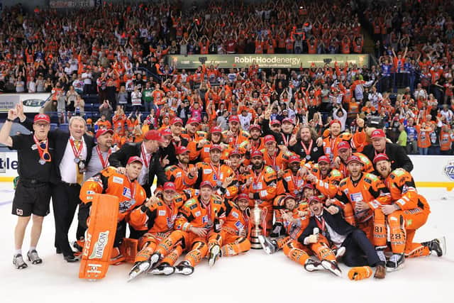 GOOD START: Davey Phillips (pictured front row) celebrates with the Sheffield Steelers after beating Cardiff Devils to win the Elite League play-off trophy in April 2017 under head coach Paul Thompson. The GB defenceman is desperate to add a regular season league title with the club . Picture: Dean Woolley.