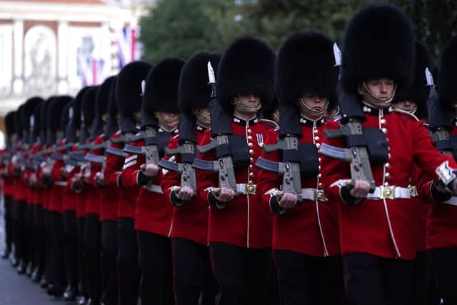 Members of the Grenadier Guards march down the High Street in Windsor following an early morning rehearsal for the funeral of Queen Elizabeth II, ahead of her funeral on Monday. Picture date: Saturday September 17, 2022. PA Photo. See PA story DEATH Queen. Photo credit should read: Andrew Matthews/PA Wire