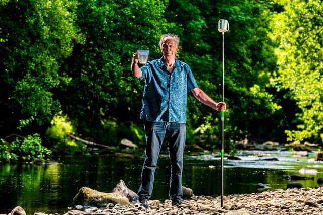 David Clayden, Chairman of the Nidd Action Group and Secretary of the Harrogate Fly Fishers' Club which was Founded in 1887. David is campaigning for the River Nidd to be granted bathing water status so that its water quality can be monitored. Pictured David Clayden, collecting water samples from the River Nidd at Duffers Pool at Darley, near Harrogate. Picture By Yorkshire Post Photographer,  James Hardisty. Date: 29th June 2023.
