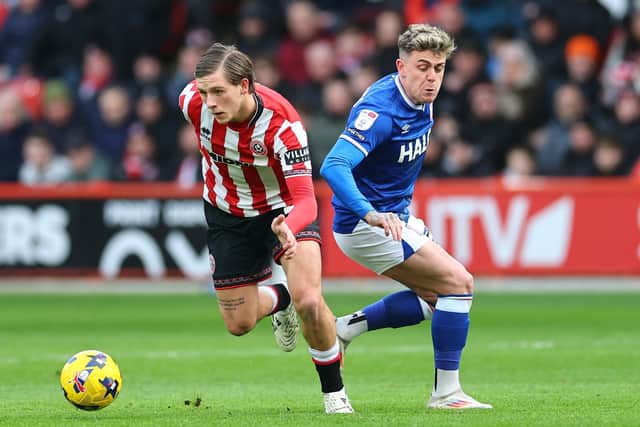 RUNNING FUED: The ill-feeling between Sydie Peck and Sam Szmodics was typical of the bad blood in the game (Image: Simon Bellis / Sportimage)