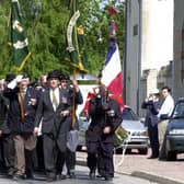 D-Day remembrance at Normandy, France, in 2004, with members of the Green Howards association parading to the Green Howards' memorial in Crepon. PIC: Chris Lawton