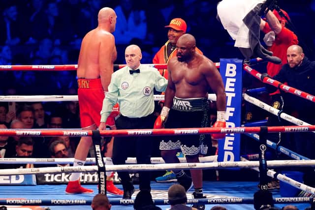 END GAME: Derek Chisora is lead back to his corner as the referee calls off his WBC World Heavyweight title fight against Tyson Fury in the 10th round at the Tottenham Hotspur Stadium on Saturday night Picture: Zac Goodwin/PA