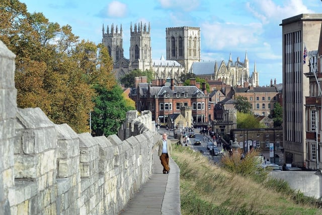 A landscape view of the York City Walls in recent years. It has a rating of four and a half stars on TripAdvisor with 9,814 reviews.