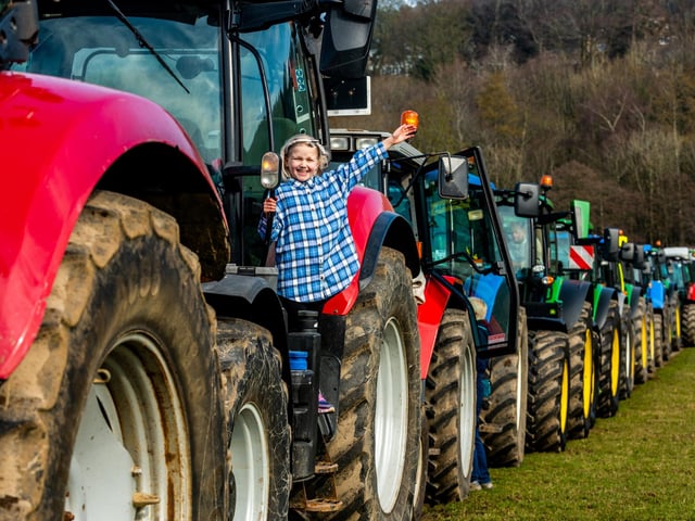Lilly Galloway, aged 8, of Wetherby waves from the steps of a CASE PUMA 140 tractor in the convoy of vehicles parked at Niddedale Showground for a short break before continuing their onward journey to Greenhow, Menwith Hill, Hampsthwaite, Birstwith, Ripley and returning back to Knaresborough. Picture: James Hardisty.