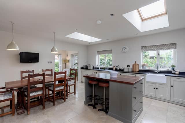 The extension houses a large kitchen/dining area and a garden room