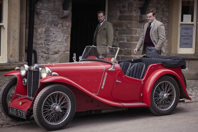 He parked where? Samuel West (Siegfried Farnon) Callum Woodhouse (Tristan Farnon) examine their new rival's car. ©5 Broadcasting Limited / © Playground Television UK Ltd. 2026 / Photographer: Helen Williams