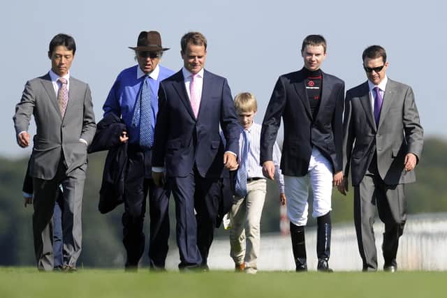 Aidan O'Brien (R) and Joseph O'Brien (2nd R) walk the course before racing at Doncaster racecourse on September 15, 2012 in Doncaster, England. (Picture: Alan Crowhurst/Getty Images)
