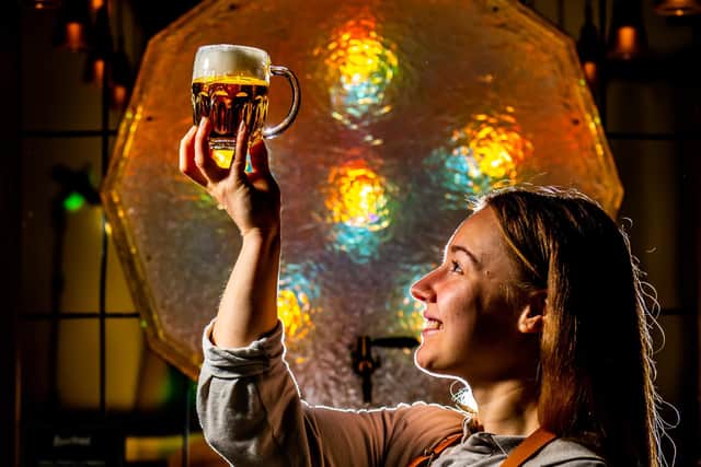 Pictured Lucie Doubravova, one of the bar staff working at The Pilsner Urquell: The Original Beer Experience. Picture By Yorkshire Post Photographer,  James Hardisty.