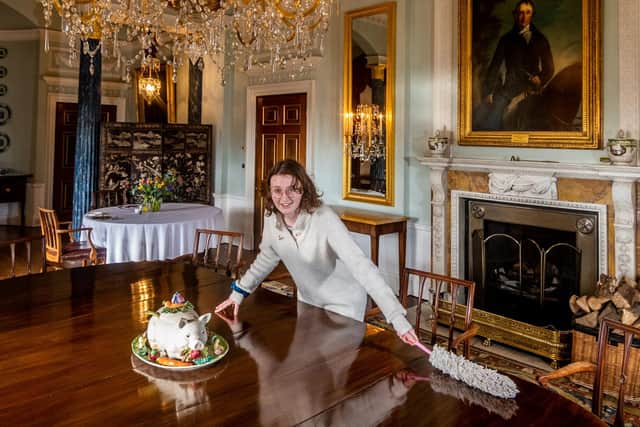 Behind The Scenes at Sledmere House, Sledmere, between Driffield and Malton, in North Yorkshire. Pictured Jessica Hyland, Curator and Exhibitions/Tour Co-ordinator, dusting down the table and chairs in the Dining Room. Picture By Yorkshire Post Photographer,  James Hardisty.