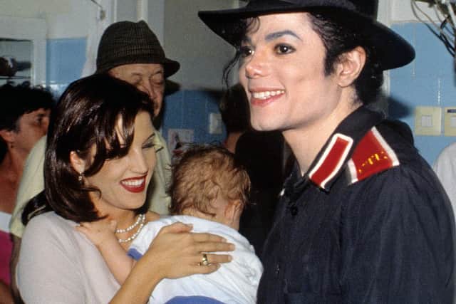 Lisa Marie Presley and Michael Jackson visiting a hospital in Budapest in 1994. 
Picture: Alamy/PA. WARNING: