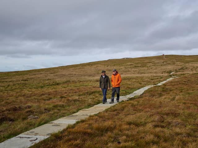 Rishi Sunak with the National Park’s chief executive David Butterworth on the new flagged pathway across the peat.