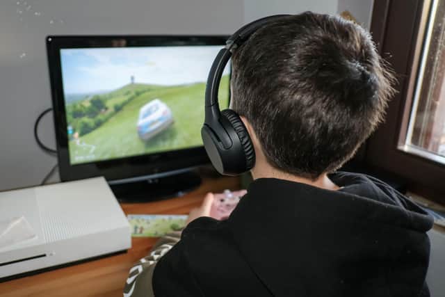 A generic photo of a boy playing video games. PIC: Alamy/PA