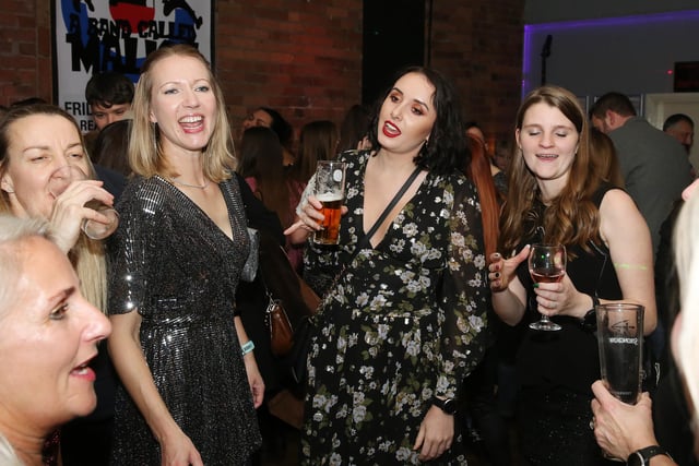 These three revellers look like they're auditioning for a 90s girl band!