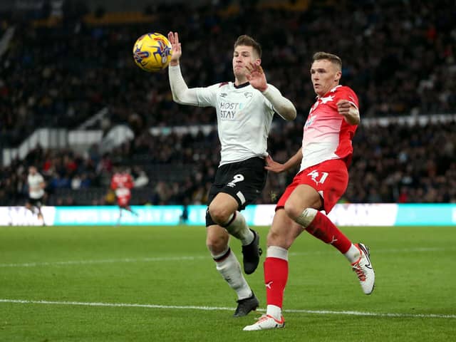 Derby County's James Collins (left) and Barnsley's Jack Shepherd (right) battle for the ball during the recent Sky Bet League One match at Pride Park. Picture: Barrington Coombs/PA Wire.