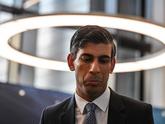 TOPSHOT - Britain's Prime Minister Rishi Sunak reacts during a visit with Microsoft founder Bill Gates at Imperial College University, in central London, on February 15, 2023. (Photo by JUSTIN TALLIS / POOL / AFP) (Photo by JUSTIN TALLIS/POOL/AFP via Getty Images)