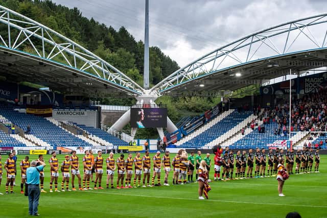 Both sets of players observe a minute's silence. (Picture: Bruce Rollinson)