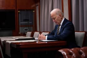 US President Joe Biden sits on a train as he goes over his speech marking the one-year anniversary of the war in Ukraine. PIC: EVAN VUCCI/POOL/AFP via Getty Images