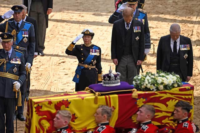 LONDON, ENGLAND - SEPTEMBER 14:  King Charles III, Prince William, Prince of Wales, Princess Anne, Princess Royal, Prince Harry, Duke of York and Prince Andrew, Duke of York follow the coffin of Queen Elizabeth II, adorned with a Royal Standard and the Imperial State Crown, arrives at the Palace of Westminster, following a procession from Buckingham Palace on September 14, 2022 in London, United Kingdom. Queen Elizabeth II's coffin is taken in procession on a Gun Carriage of The King's Troop Royal Horse Artillery from Buckingham Palace to Westminster Hall where she will lay in state until the early morning of her funeral. Queen Elizabeth II died at Balmoral Castle in Scotland on September 8, 2022, and is succeeded by her eldest son, King Charles III. (Photo by Ben Stansall - WPA Pool/Getty Images)