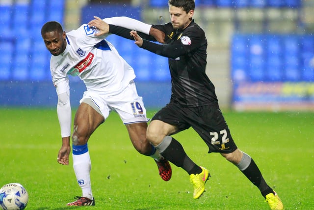 Rob Taylor looks to get past Tranmere's Janoi Donacien.
