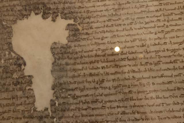 A detail of a piece of Magna Carta, 1225, at the British Museum on May 11, 2021. PIC: Dan Kitwood/Getty Images